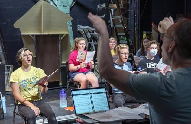 Dr. Greg Ramsdell conducts vocal rehearsal at the music & theatre summer camp.